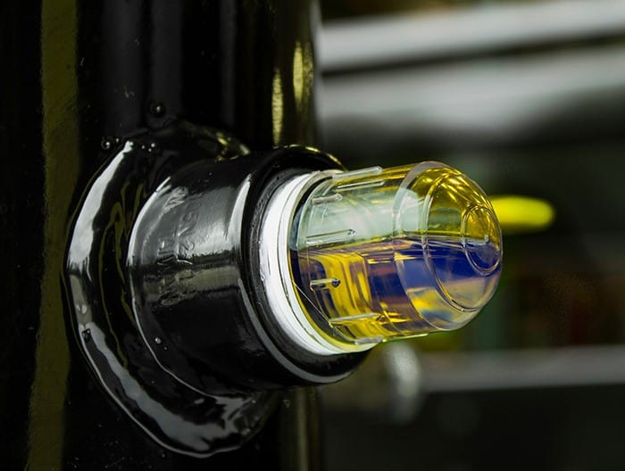 A bullseye-type sight glass allows oil to be viewed from virtually any angle